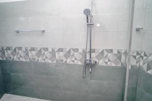 a shower with a glass door in a bathroom at Elegance Lake View in Habaraduwa Central +69 photos
