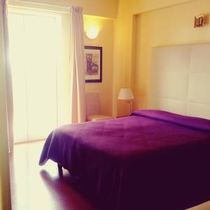 Postel nebo postele na pokoji v ubytování Hotel Paclà