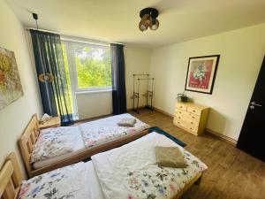 Posteľ alebo postele v izbe v ubytovaní Dolpo 55