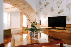 TV a/nebo společenská místnost v ubytování Santa Rosa Relais