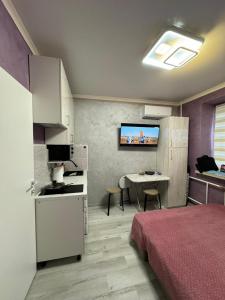 Kuchyň nebo kuchyňský kout v ubytování Апартаменты Компания Феникс