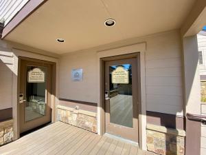 a front door of a house with two signs on it at Quicksilver 1671 by SummitCove Lodging in Keystone +41 photos