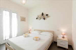 Postel nebo postele na pokoji v ubytování GuestHost - Salento Sole e Mare Luxury with Pool + 28 fotografií