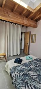 Postel nebo postele na pokoji v ubytování Gîte de Riosset + 9 fotografií