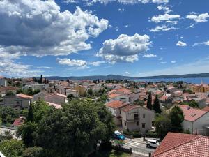 a cityscape of a town under a cloudy sky at Apartman Karla in Selce +5 photos