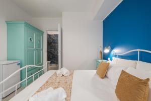 Postel nebo postele na pokoji v ubytování Sa Domu Colorada- Eleganza e comfort nel centro di Villasimius