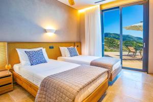 Posteľ alebo postele v izbe v ubytovaní Villa Yasemi by Villa Plus