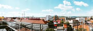 a view of a city from a balcony at Central 28 in Cluj-Napoca