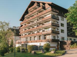 a building with balconies on the side of it at Cozy Bergzeit 230 - Mountain View, Stylish, Familyfriendly in Bad Goisern