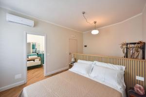 Postel nebo postele na pokoji v ubytování Lingotto Rooms