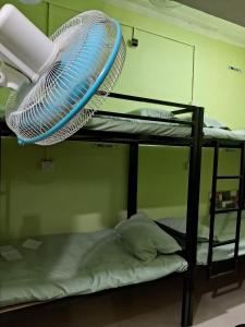 Postel nebo postele na pokoji v ubytování Homestay Dormitory