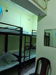 Postel nebo postele na pokoji v ubytování Homestay Dormitory