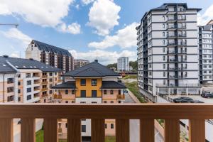 a view of a city from a balcony with buildings at Vip Bogic 79 in Zlatibor