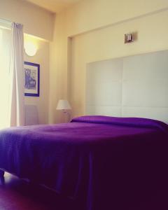 Postel nebo postele na pokoji v ubytování Hotel Paclà