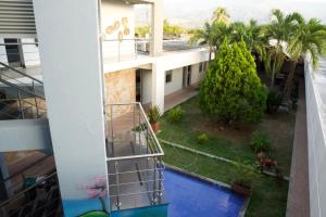 an aerial view of a building with a swimming pool at Hotel y Restaurante BCB La Jagua in La Jagua de Ibirico