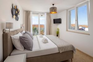 Postel nebo postele na pokoji v ubytování Villa Aurelia + 7 fotografií