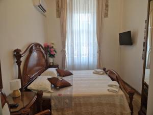 Postel nebo postele na pokoji v ubytování Giovanna Boutique Rooms & Pool