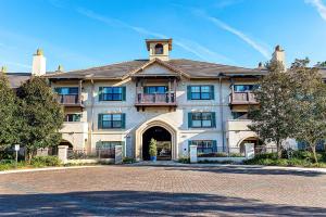 a large house with a driveway in front of it at Luxury Couples Getaway w Dual Spa Shower 6308P1 in Saint Augustine