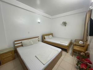 Postel nebo postele na pokoji v ubytování Nhà nghỉ trọ Mai Vân + 1 fotografie