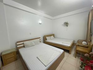 Postel nebo postele na pokoji v ubytování Nhà nghỉ trọ Mai Vân