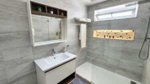 a white bathroom with a sink and a shower at R&S Marina Bay Tanger in Tangier +19 photos