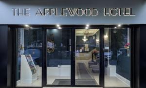 a store front with a sign that reads the apple wood hotel at Applewood Hotel in Bournemouth