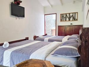 Voodi või voodid majutusasutuse EcoHotel El Castillo Pance toas