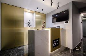 a lobby with a sculpture on a counter at Luxury Apartments in Villa Curiera in Malinska