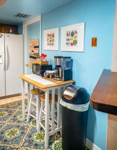 a kitchen with a table with a coffee maker on it at Bohemian Bungalow in Port Saint Lucie