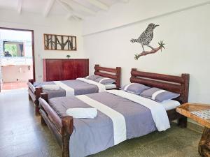 Voodi või voodid majutusasutuse EcoHotel El Castillo Pance toas