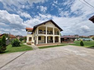 a white house with a black roof at Hajr Villa in Ilidža