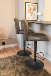 two chairs sitting in front of a desk at Amber Corner I Brand New Flat Top Location in Sofia +5 photos