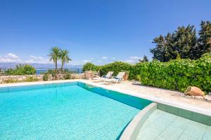 The swimming pool at or close to Villa Nafsika