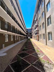 an empty hallway of an apartment building at Departamento a cuadras del nuevo hospital in Chillán +2 photos