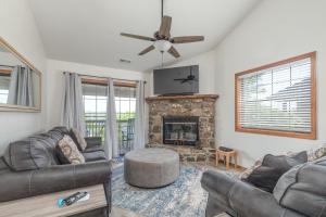 a living room with a couch and a fireplace at 2BR Village At Indian Point 1112 near SDC - Free Tickets Daily up to $500 in Branson