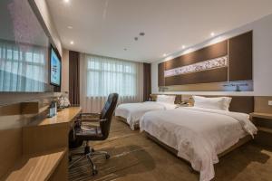 Postel nebo postele na pokoji v ubytování Lavande Hotel Beijing Asian Games Village