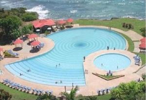 Bazén v ubytování Gwad'ACTE nebo v jeho okolí