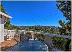 a balcony of a house with a table and chairs at Casa Coventry in Cambria