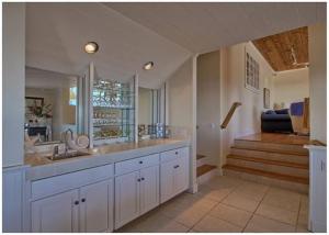 a large bathroom with a sink and a staircase at Casa Coventry in Cambria