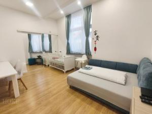 a living room with a couch and a table at Ruyi holiday -Családi ház in Sopron