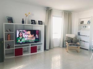 TV a/nebo společenská místnost v ubytování Hija del Volcán