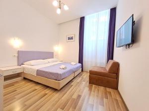 Posteľ alebo postele v izbe v ubytovaní Medulić Palace Rooms & Apartments + 37 fotografií