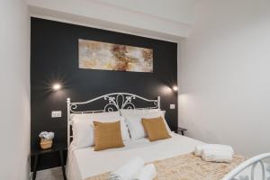 Postel nebo postele na pokoji v ubytování Sa Domu Colorada- Eleganza e comfort nel centro di Villasimius
