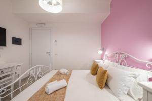 Postel nebo postele na pokoji v ubytování Sa Domu Colorada- Eleganza e comfort nel centro di Villasimius