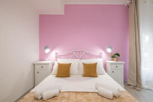 Postel nebo postele na pokoji v ubytování Sa Domu Colorada- Eleganza e comfort nel centro di Villasimius