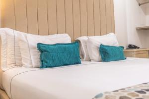 Postel nebo postele na pokoji v ubytování Hotel Costa Bonita