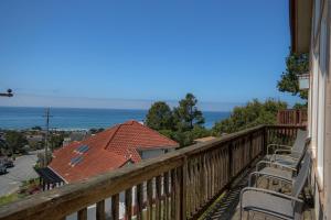 a balcony with chairs and a view of the ocean at Dream Catcher in Cambria