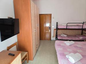 Postel nebo postele na pokoji v ubytování Hotel Rosa