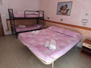 Postel nebo postele na pokoji v ubytování Hotel Rosa
