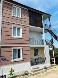 a house with a red and white at chill in batumi in Batumi +7 photos